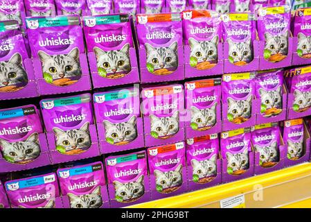 Samara, Russia - June 7, 2022: Various Whiskas cat food ready for sale on supermarket shelves. Cat food as background Stock Photo