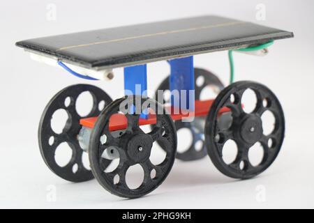Solar powered car which is an educational toy that teaches concepts of energy conversions. 3D printed wheels for solar car Stock Photo