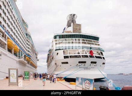 Cozumel, Mexico: January 17, 2019: Two Royal Caribbean cruise ships dock in the port of Cozumel as tourist board and unboard from the ships. Stock Photo