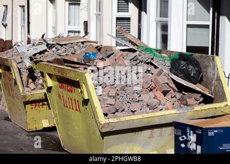 builders skips full of building rubble old bricks during redevelopment of victorian terraced houses =strandtown, east belfast, northern ireland, uk Stock Photo