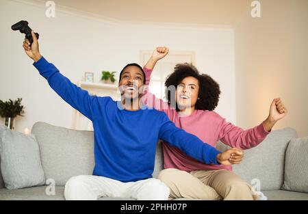 African American Boyfriend Winning Video Game Girlfriend Stock Photo by  ©EdZbarzhyvetsky 181571646