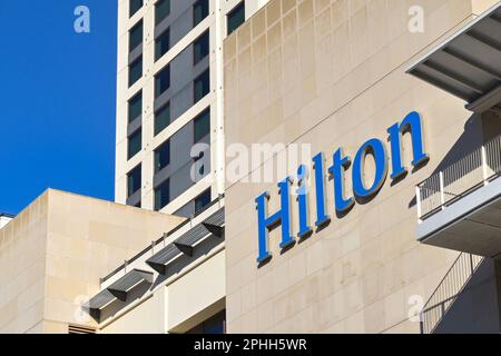 Austin, Texas, USA - February 2023: Sign on the side of the Hilton hotel in the city centre Stock Photo