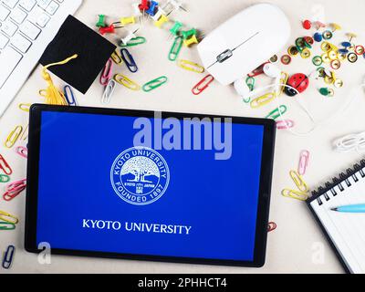 In this photo illustration, Kyoto University  logo seen displayed on a tablet. Stock Photo