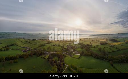 Morning light, the White Peak of the English Peak District, flying over Tissington in a hot air ballon, looking at the landscape of fields and trees Stock Photo