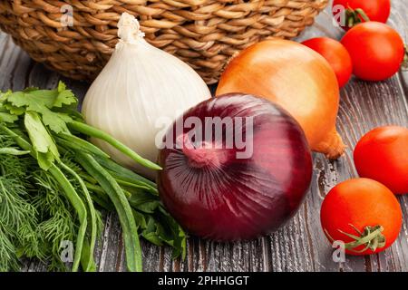 colorful onions on wood background Stock Photo