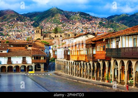 Cusco Old town, Peru, view of the traditional colonial style houses with balconies and archways on the main square Plaza de Armas, St Francis church a Stock Photo