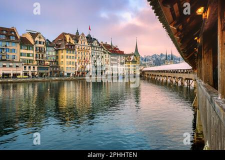 Lucerne city, Switzerland, view from the wooden Chapel bridge to the facades of the Old town on a winter day Stock Photo