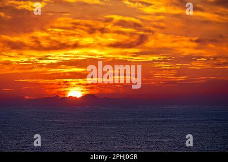 Xlendi, Gozo island, Malta. 22th Mar, 2023. Sunset over Xlendi Bay in the southwest of Gozo island in Malta. Stock Photo