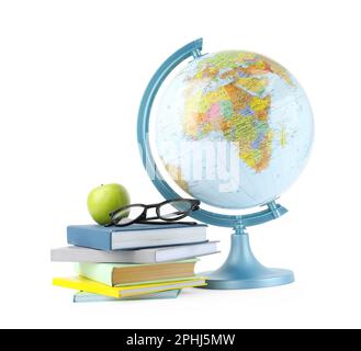 Plastic model globe of Earth, apple, eyeglasses and books on white background. Geography lesson Stock Photo