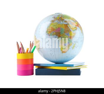 Plastic model globe of Earth, colorful pencils and books on white background. Geography lesson Stock Photo