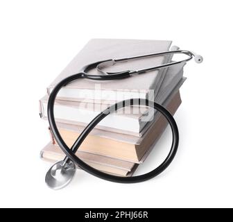 Stack of student textbooks and stethoscope on white background. Medical ...