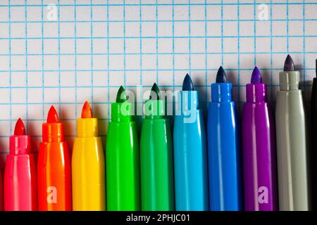 Opened multicolored markers on notebook, nobody Stock Photo
