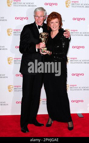 File photo dated 18/05/14 of Cilla Black with the Special Award, alongside presenter Paul O'Grady, at the Arqiva British Academy Television Awards 2014 at the Theatre Royal, Drury Lane, London. TV presenter and comedian Paul O'Grady has died at the age of 67, his partner Andre Portasio has said. The TV star, also known for his drag queen persona Lily Savage, died 'unexpectedly but peacefully' on Tuesday evening, a statement shared with the PA news agency via a representative said. Issue date: Wednesday March 29, 2023. Stock Photo