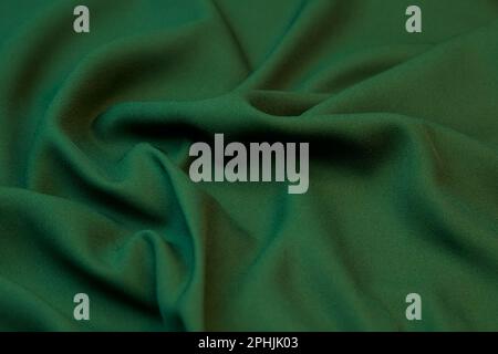Green fabric background. Selective focus. Stock Photo