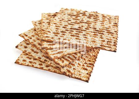 Pesach celebration concept - Jewish holiday Pesach. Stacked matzah isolated on white background. Copy space for text. Stock Photo