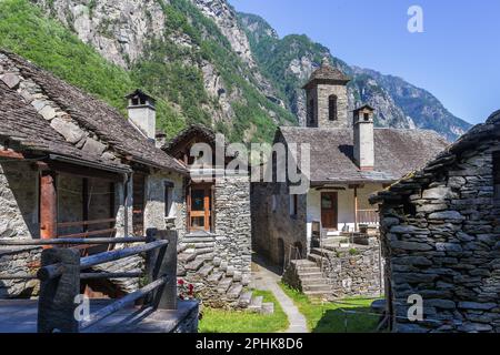The tradtional stone houses with church tower in the beautiful village of Foroglio, Ticino, Switzerland Stock Photo