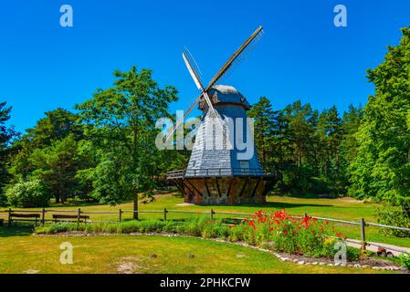 Wooden windmill at Seaside Open Air Museum in Latvian town Ventspils. Stock Photo