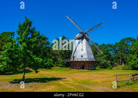 Wooden windmill at Seaside Open Air Museum in Latvian town Ventspils. Stock Photo