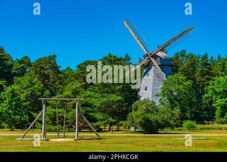 Wooden windmill at Seaside Open Air Museum in Latvian town Ventspils. Stock Photo