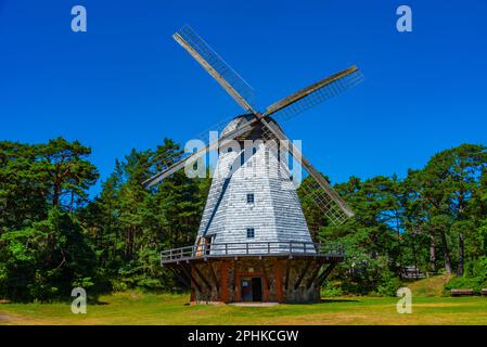 Wooden windmill at Seaside Open Air Museum in Latvian town Ventspils. Stock Photo