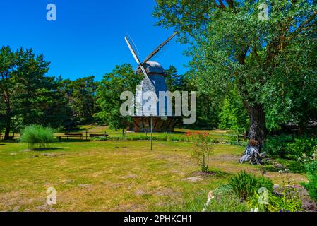 Wooden windmill at Seaside Open Air Museum in Latvian town Ventspils. Stock Photo