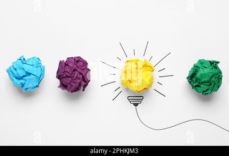 Creative flat lay composition with colorful paper balls on white background. Idea concept Stock Photo