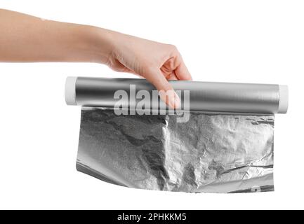 Woman holding roll of aluminum foil on white background, closeup Stock Photo