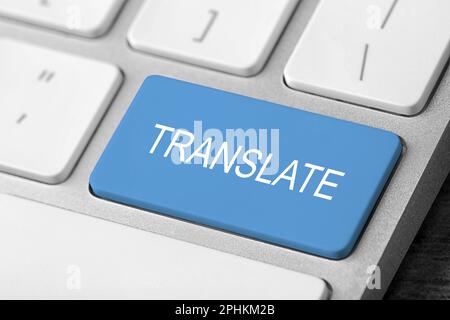 Blue button with word TRANSLATE on computer keyboard, closeup view Stock Photo