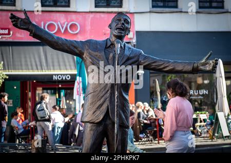 Statue of the celebrated singer and actor Jacques Brel at Place de la Vieille Halle aux Blés in Brussels, Belgium. Stock Photo