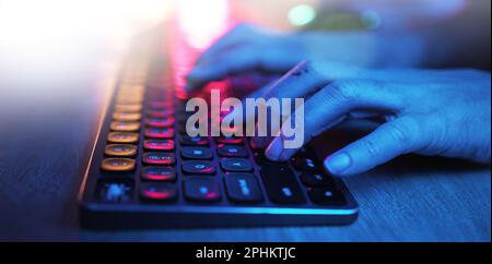 Hacker, hands and typing on neon keyboard for software, programming or cybersecurity. Developer, it coder and woman on computer keypad for hacking Stock Photo