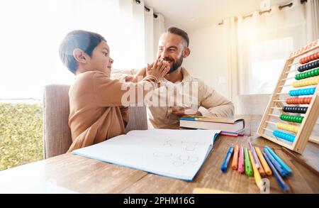 Happy, education and father high five with child to celebrate after studying alphabet, homework help or homeschool. Family success, learning or boy Stock Photo