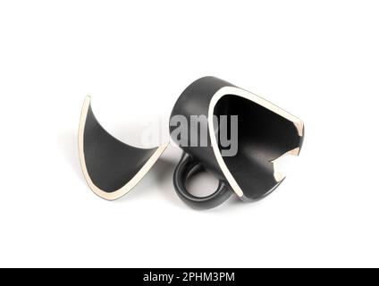 Broken Mug Isolated, Black Ceramic Cup Pieces, Smashed Teacup, Careless Concept, Empty Broken Mug on White Background Stock Photo
