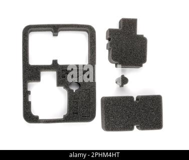 Packaging foam for electronic equipment isolated. Gray sponge pad for protection during transportation Stock Photo