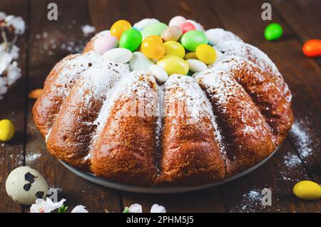 Easter Cake, Traditional Cake Decorated with Sugar Eggs on Wooden Background Stock Photo