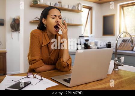 Woman is tired, yawning and remote work with laptop, burnout and overworked with bored employee. Working from home, freelancer and fatigue Stock Photo