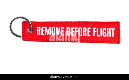 A remove before flight ribbon on a jet airplane. Close-up Stock Photo -  Alamy