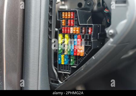 Car fuse box multicolor and multi protection current fused, Power distribution box in car dashboard Stock Photo