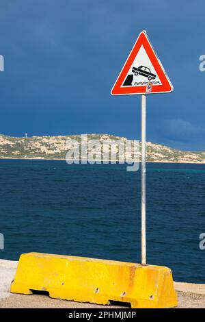 Warning triangle traffic sign of unprotected quayside and danger ...