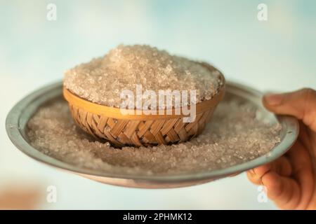 sugar kept in bamboo bowl from top angle at day with isolated background Stock Photo