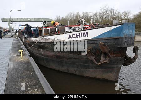 29 March 2023, Bavaria, Wörth An Der Donau: A wrecked ship floats in the Geisling lock. After the ship's accident, the lock chamber was slowly filled after the ship was made buoyant again in order to get the accident victim out of the lock. Photo: Felix Hörhager/dpa Stock Photo