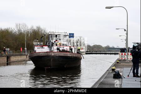 29 March 2023, Bavaria, Wörth An Der Donau: A wrecked ship is floating in the Geisling lock. After the ship has been made buoyant again, the lock chamber is slowly filled in order to get the casualty out of the lock. Photo: Felix Hörhager/dpa Stock Photo