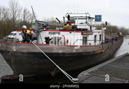 29 March 2023, Bavaria, Wörth An Der Donau: A wrecked ship floats in the Geisling lock. After the ship's accident, the lock chamber was slowly filled after the ship was made buoyant again in order to get the accident victim out of the lock. Photo: Felix Hörhager/dpa Stock Photo