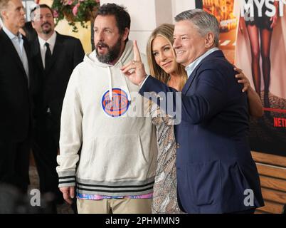 Los Angeles, USA. 28th Mar, 2023. MURDER MYSTERY 2 Cast & Crew - (Standing,  L-R) Jason Young, Ori Marmur, Zurin Villanueva, Ted Sarandos, Jodie  Turner-Smith, Adam Sandler, Scott Stuber, Jennifer Aniston, Jeremy