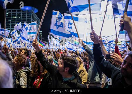 Tel Aviv, Israel. 25th Mar, 2023. Israeli protesters wave their Israeli flags during an anti-reform demonstration in Tel Aviv. Over 230,000 people protest in Tel Aviv against Netanyahu's far-right government and its controversial legal reform. Credit: SOPA Images Limited/Alamy Live News Stock Photo