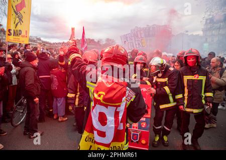 Paris, France. 28th Mar, 2023. Firefighters in their uniforms join in on the mass demonstrations against pension reform in Paris. President Emmanuel Macron wants to introduce a bill which will raise the retirement age from 62 to 64. Credit: SOPA Images Limited/Alamy Live News Stock Photo