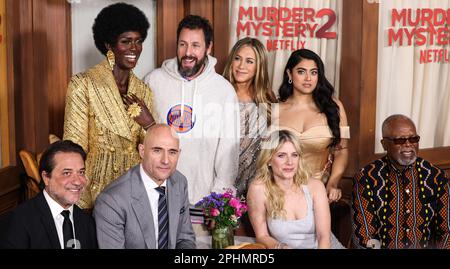 Los Angeles, USA. 28th Mar, 2023. (L-R) MURDER MYSTERY 2 Cast - Enrique  Arce, Jodie Turner-Smith, Mark Strong, Adam Sandler, Jennifer Aniston,  Mélanie Laurent, Kuhoo Verma and Dr. John Kani at the