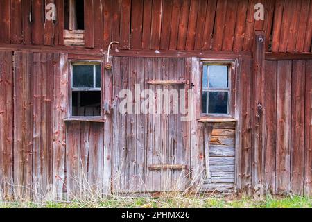 Old abandoned red barn in the countryside Stock Photo