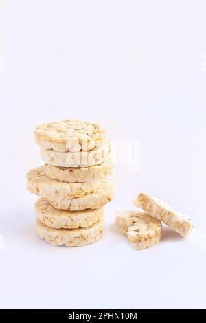 Stack of puffed rice cakes isolated on white background. Healthy snacks food concept Stock Photo