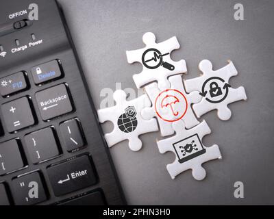 Wireless keyboard and puzzle with Cyber virus with antivirus protection icons.The concept of virtual world security Stock Photo