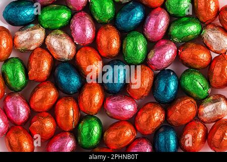 Colorful Easter eggs background. Chocolate Easter eggs texture. Top view Stock Photo